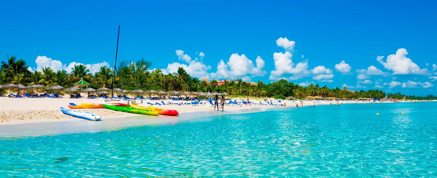 The Beautiful Beach Of Varadero In Cuba With Colorful Boats And Thatched Umbrellas Image Taken From The Sea